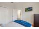 Bright bedroom with a closet, television, and soothing, comfortable bedding for a relaxing and restful atmosphere at 2098 Carpathian Dr, Apopka, FL 32712