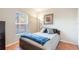 Cozy bedroom bathed in natural light, featuring a comfortable bed, a window view, and a warm, inviting atmosphere at 2098 Carpathian Dr, Apopka, FL 32712