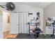 Functional home gym featuring weights, a workout bench, and mirrors, ideal for maintaining an active and healthy lifestyle at 2098 Carpathian Dr, Apopka, FL 32712