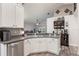 Open kitchen featuring stainless appliances and breakfast bar with view to living area at 2098 Carpathian Dr, Apopka, FL 32712