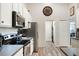 Kitchen featuring stainless steel appliances, white cabinets and gray countertop at 2098 Carpathian Dr, Apopka, FL 32712