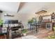 Stylish living room featuring a home bar area with custom wooden bar and shelving, seating, and modern flooring at 2098 Carpathian Dr, Apopka, FL 32712