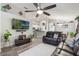 Open-concept living space with modern furnishings, high ceilings, and views into the adjacent kitchen at 2098 Carpathian Dr, Apopka, FL 32712