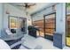 This screened-in patio features a Blackstone grill and furniture at 2098 Carpathian Dr, Apopka, FL 32712