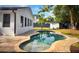 Beautiful backyard pool surrounded by brick pavers, perfect for outdoor relaxation and entertaining at 245 W George Ave, Maitland, FL 32751