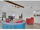 Spacious living room with hardwood floors, dining table, and comfortable seating at 245 W George Ave, Maitland, FL 32751