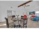 Bright living room with hardwood floors, ceiling fan, and dining table at 245 W George Ave, Maitland, FL 32751