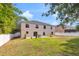 A spacious backyard featuring patio space and a two-story home at 2658 Palmetto Ridge Cir, Apopka, FL 32712