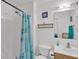 Bright bathroom featuring a shower and vanity with a decorative mirror at 2658 Palmetto Ridge Cir, Apopka, FL 32712