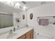Bright bathroom featuring a mirror, vanity, towels, and toilet at 2658 Palmetto Ridge Cir, Apopka, FL 32712