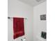 Bright bathroom featuring a towel rack, toilet, and floral decor at 2658 Palmetto Ridge Cir, Apopka, FL 32712
