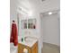 Well-lit bathroom with a vanity, large mirror, and a glimpse into an adjacent room at 2658 Palmetto Ridge Cir, Apopka, FL 32712