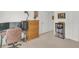 Bright bedroom with white walls, small bookcase and wood dresser at 2658 Palmetto Ridge Cir, Apopka, FL 32712