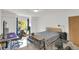 Bright bedroom with natural light, dual closets, and a dedicated workspace at 2658 Palmetto Ridge Cir, Apopka, FL 32712