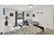 Bright bedroom featuring two beds, a window, and artwork at 2658 Palmetto Ridge Cir, Apopka, FL 32712