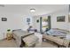 Bedroom with two beds and a window with natural light at 2658 Palmetto Ridge Cir, Apopka, FL 32712