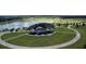 Aerial view of the community park featuring a lake, amphitheater, and walking paths at 2658 Palmetto Ridge Cir, Apopka, FL 32712