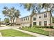 Traditional home featuring a manicured lawn, a two-car garage, and a neutral color palette at 2658 Palmetto Ridge Cir, Apopka, FL 32712