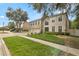Two-story home in a neighborhood with a well-maintained lawn and landscaping at 2658 Palmetto Ridge Cir, Apopka, FL 32712