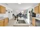 Open kitchen featuring granite countertops, an island, and a view into the dining and living areas at 2658 Palmetto Ridge Cir, Apopka, FL 32712