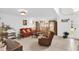 Comfortable living room with neutral paint, plush seating, and abundant natural light at 2658 Palmetto Ridge Cir, Apopka, FL 32712