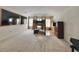 Expansive living room with natural light, built-in shelves, and carpet flooring at 2658 Palmetto Ridge Cir, Apopka, FL 32712