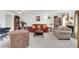 Inviting living room with carpeting, comfortable furniture, and plenty of natural light at 2658 Palmetto Ridge Cir, Apopka, FL 32712