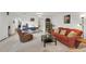 Comfortable living room with neutral-toned carpet and furniture, and natural lighting at 2658 Palmetto Ridge Cir, Apopka, FL 32712
