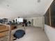 Large room featuring a desk setup, ample storage, and neutral carpet, ideal for various activities at 2658 Palmetto Ridge Cir, Apopka, FL 32712