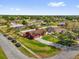 Aerial view of home on corner lot with long driveway, well maintained lawn, and mature trees at 2665 E Juliet Dr, Deltona, FL 32738