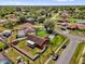 Aerial view of backyard featuring patio, shed, pool, white fence, and palm trees at 2665 E Juliet Dr, Deltona, FL 32738