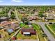 Aerial view of house on corner lot surrounded by trees, fenced yard, and swimming pool at 2665 E Juliet Dr, Deltona, FL 32738