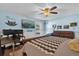Bedroom with a ceiling fan, TV, a comfortable bed, workspace, and decor at 2665 E Juliet Dr, Deltona, FL 32738