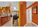 Bright and airy interior view from kitchen to dining to hallway to living room, with colorful accents at 2665 E Juliet Dr, Deltona, FL 32738