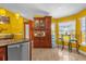 Bright eat-in kitchen featuring custom wood cabinets, a breakfast bar, and stainless steel appliances at 2665 E Juliet Dr, Deltona, FL 32738