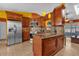 Beautiful kitchen featuring stainless steel appliances, granite countertops, and a stylish tile backsplash at 2665 E Juliet Dr, Deltona, FL 32738