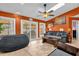 Inviting living room with skylights, ceiling fan, tile floors and sliding glass doors to the exterior at 2665 E Juliet Dr, Deltona, FL 32738