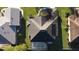 Aerial view of home featuring a pool, solar panels, and landscaping at 27127 Stoney Brook Dr, Leesburg, FL 34748