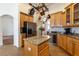 Well-lit kitchen with stainless steel appliances, a wine cooler, and ample counter space at 27127 Stoney Brook Dr, Leesburg, FL 34748
