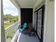 Inviting balcony with seating area overlooking a serene view at 280 Celebration Blvd # 208, Kissimmee, FL 34747