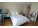 Well-lit bedroom with hardwood floors, ceiling fan and neutral decor at 280 Celebration Blvd # 208, Kissimmee, FL 34747