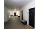 Hallway features multiple unit doors with seating and textured flooring at 280 Celebration Blvd # 208, Kissimmee, FL 34747