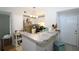 Bright kitchen with stainless steel appliances and breakfast bar at 280 Celebration Blvd # 208, Kissimmee, FL 34747