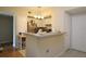 Bright kitchen with white cabinets, breakfast bar, and modern stainless steel appliances at 280 Celebration Blvd # 208, Kissimmee, FL 34747