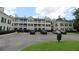 Condo building with convenient parking lot and well-maintained landscaping at 280 Celebration Blvd # 208, Kissimmee, FL 34747