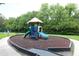 Colorful community playground with slides and play structure amidst lush greenery for Gathering fun at 280 Celebration Blvd # 208, Kissimmee, FL 34747