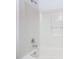 Bathroom featuring a white tiled tub with chrome fixtures at 2818 Irondale St, Deltona, FL 32738