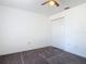 A bright bedroom features carpet flooring, a ceiling fan, and a closet at 2818 Irondale St, Deltona, FL 32738