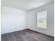 Cozy bedroom with a window and neutral color scheme offers a serene retreat at 2818 Irondale St, Deltona, FL 32738