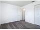 Neutral-toned bedroom with carpet, closet, and an open doorway provides a blank canvas at 2818 Irondale St, Deltona, FL 32738